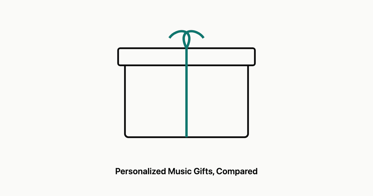 A wrapped gift tied with twine alongside headphones and an open music notebook on a warm desk